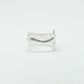 Sculptural silver ring showcasing both a heart and star form, with small gemstones set into each motif. Handmade and one of a kind.