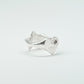 Sculptural silver ring showcasing both a heart and star form, with small gemstones set into each motif. Handmade and one of a kind.