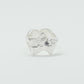 Sculptural silver ring showcasing both a heart and star form, with small gemstones set into each motif. Handmade and one of a kind.