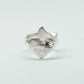 Sculptural silver ring showcasing both a heart and star form, with small gemstones set into each motif. Handmade and one of a kind.