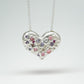 Bulbous heart-shaped sterling silver pendant, hand-sculpted with drilled textures and encrusted with small scattered gemstones. Playful and raw, with a cartoon-like silhouette.