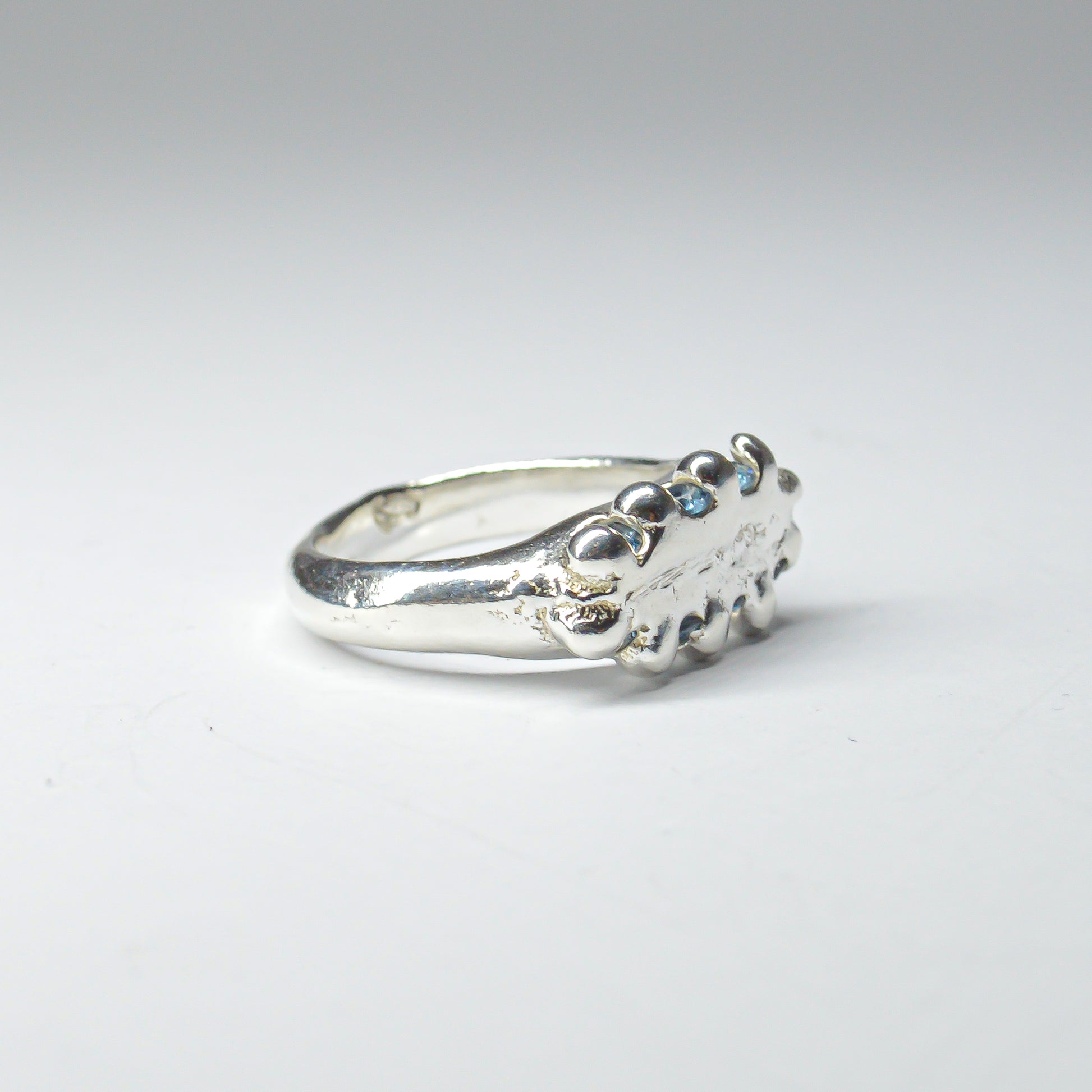 CATERPILLAR CROWN RING - BLUE GEMS