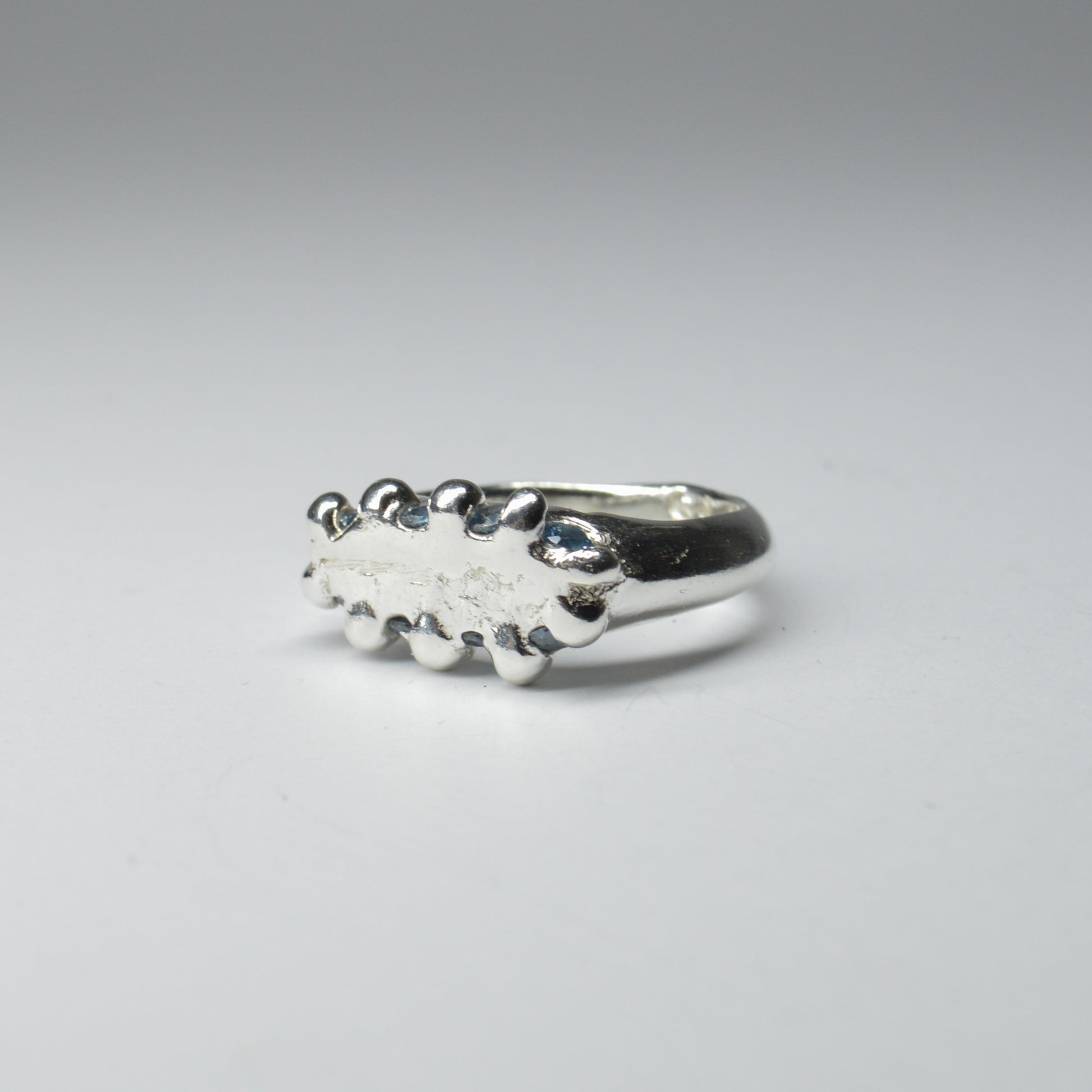 CATERPILLAR CROWN RING - BLUE GEMS